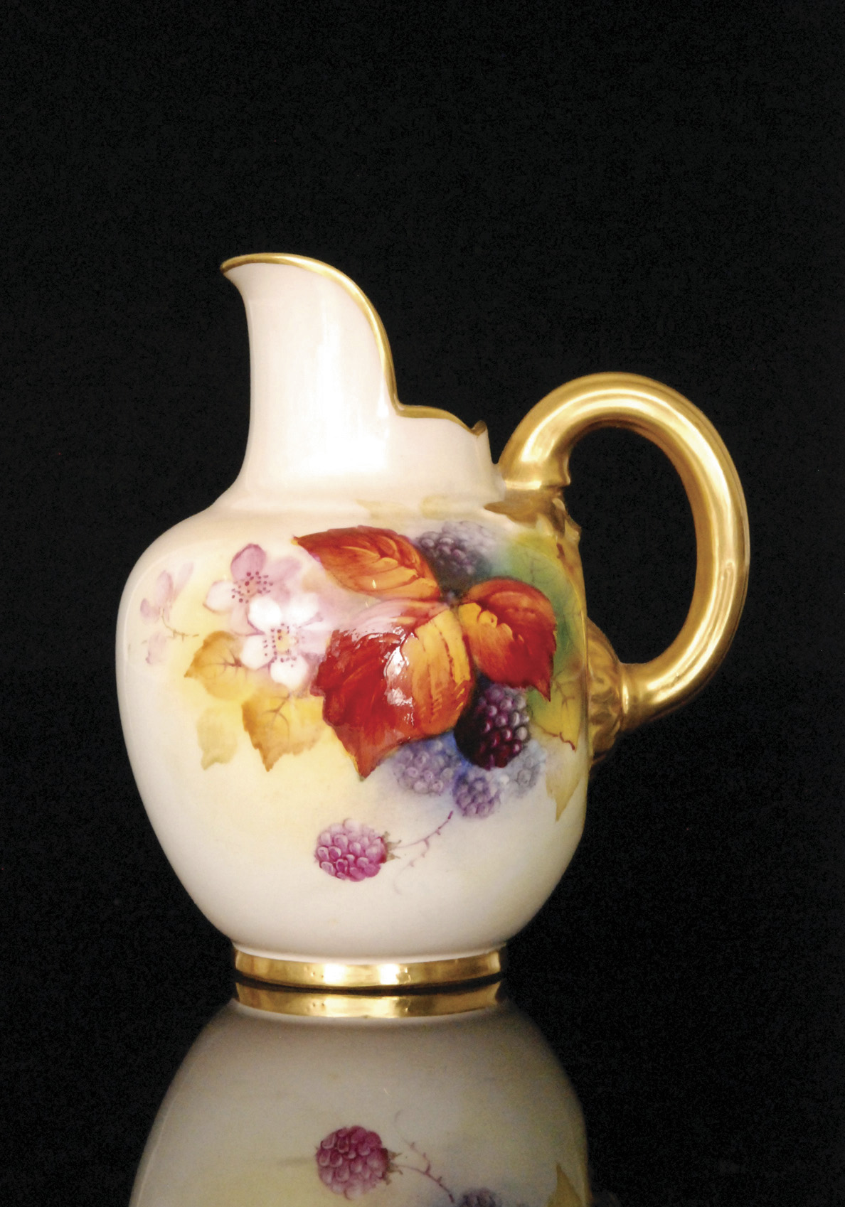 A Royal Worcester flat back jug decorated by Kitty Blake with autumnal fruits and berries against a