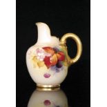 A Royal Worcester flat back jug decorated by Kitty Blake with autumnal fruits and berries against a