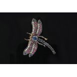 A silver gilt brooch modelled as a dragonfly set with rows of diamonds,