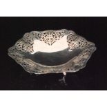 A George V hallmarked silver pierced basket of hexagonal outline,