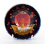 A William Moorcroft footed bowl decorated in the Pomegranate pattern,