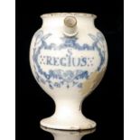 An early 18th Century Delft wet drug jar painted in a pale blue with a cartouche inscribed S REGIUS