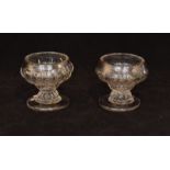 A pair of 18th Century crystal glass table salts circa 1760 with a moulded ogee form bowl above a