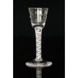 A mid 18th Century wine glass circa 1765 with a stepped round funnel Lynn bowl above a double