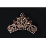 A 19th Century yellow metal Bohemian garnet coronet brooch of curved outline,