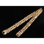 An 18ct Chiampesan style link bracelet formed of seven yellow gold coupled links and spaced by