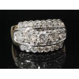 An 18ct diamond cluster ring, three rows of brilliant cut stones,