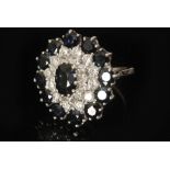 An 18ct white gold sapphire and diamond target cluster ring,