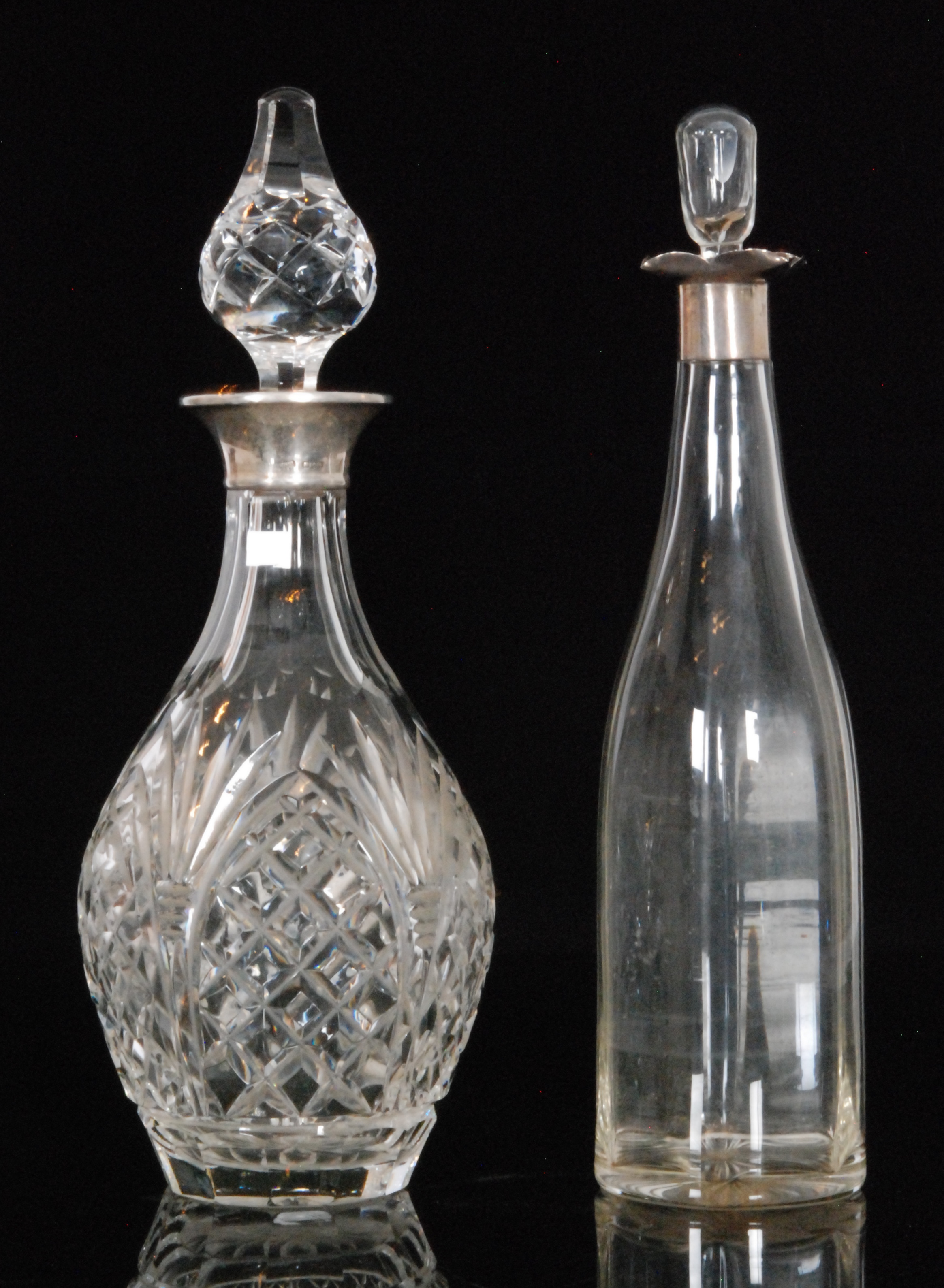 A mid 20th Century silver mounted cut glass decanter of baluster form, with plain silver collar,