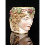A 19th Century Derby Bacchus mug with gilt border edges and detailing to the handle, painted mark,