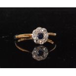 An early 20th Century 18ct sapphire and diamond daisy cluster ring,