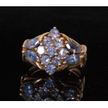 A 9ct hallmarked tanzanite ring comprising of nine central stones set in a marquise formation