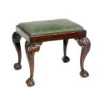 An Edwardian carved mahogany dressing stool in the Chippendale style,