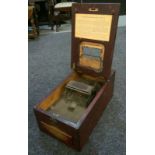 An early 20th Century mahogany counter top till with lever operation,