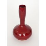 Bernard Moore - An early 20th Century Chinese shaped vase decorated in a red flambe glaze,