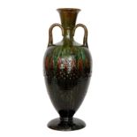 Christopher Dresser - Linthorpe - A large twin handled vase decorated to the body with incised