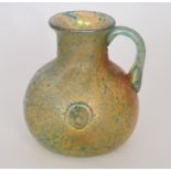 Stevens & Williams - An early 20th Century Caerleon Ware jug of spherical form with collar neck,