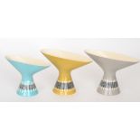 John Clappison - Hornsea Slipware - Three vases of conical form with a flared oval neck in blue,