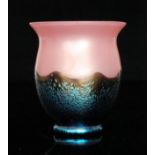 Loetz - An early 20th Century glass vase of footed ovoid form with everted rim,