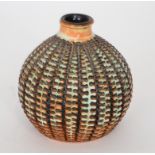 Beatrice Bolton - Poole Pottery - An Atlantis onion shape vase decorated with a carved repeat