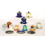 A collection of assorted 1930s Carlton Ware preserve pots, covers and stands,