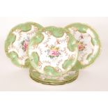 An early 20th Century dessert service comprising six 24cm diameter plates each decorated with a