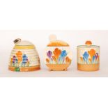 A group of three Clarice Cliff preserve pots to comprise a small Drum shape,