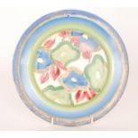 A Clarice Cliff circular side plate circa 1934 hand painted in the Blue Chintz pattern with