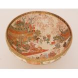 A late 19th Century Japanese Satsuma footed bowl, the interior decorated with figures sat in