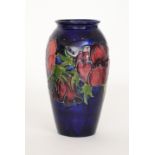 A Moorcroft Anemone pattern vase of swollen barrel form decorated with tubelined flowers and