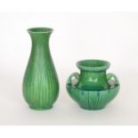 A Pilkingtons twin handled urn decorated in an all over green glaze with darker glaze pooling,