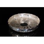 A Victorian hallmarked silver circular shallow bowl with wrythen embossed foliate scrolls within