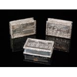 Three modern hallmarked silver castle top pill boxes, each of rectangular outline,