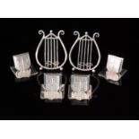 A pair of Victorian hallmarked silver menu card holders, each in the form of a lyre, Chester 1897,