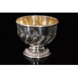 An Edwardian hallmarked silver pedestal bowl of circular outline with part fluted and foliate