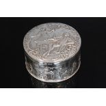 A late 19th Century Dutch silver tobacco box and cover of circular outline,