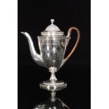 A George III hallmarked silver coffee pot with reeded and bright cut border decoration and centred
