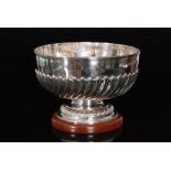 A Victorian hallmarked silver rose bowl of circular outline with half fluted decoration to