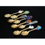 Seven Danish silver gilt and enamel Christmas spoons, all designed for Anton Michelsen, dated 1955,