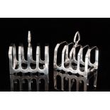 A pair of George VI hallmarked silver four division toast racks, each of arched form,