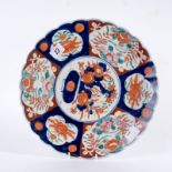 Large circular Oriental charger decorated in Imari colours
