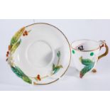 3 footed cabinet cup and saucer having applied floral decoration