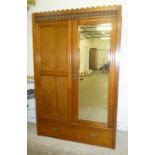 Fitted early C20th wardrobe with bevel mirrored door