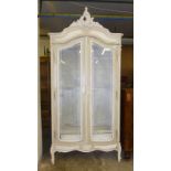 Double opening French armoire with double edged glazed doors and ornate cornice 44” x 17” x 97”