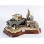 Border Fine Arts figurine of a farmer loading milk churns onto a landrover