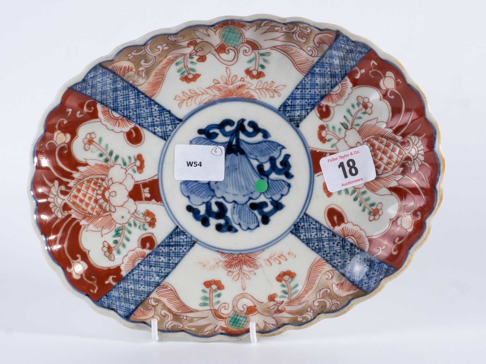 Oval oriental plate decorated in Imari colours