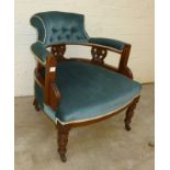 Blue upholstered and deep buttoned ladies armchair with carved slats