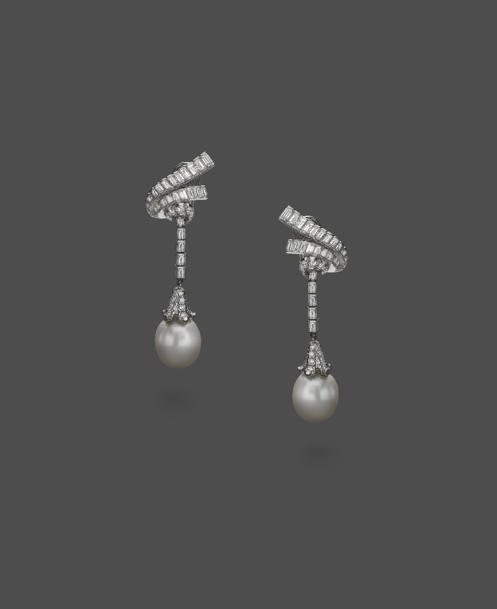 A Pair Of Platinum, Diamond And South Sea Cultured Pearl Ear Pendants Each designed as a scroll