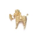 An Amusing "Poodle" Clip Designed as a sculpted and chiseled little dog holding a small basket,