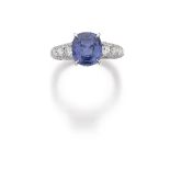 A Sapphire And Diamond Ring The cushion-shaped sapphire weighing 3.93 carats to the pave set